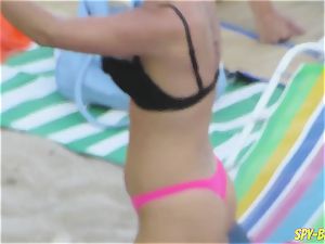 pinkish bathing suit first-timer bare-chested hidden cam Beach femmes